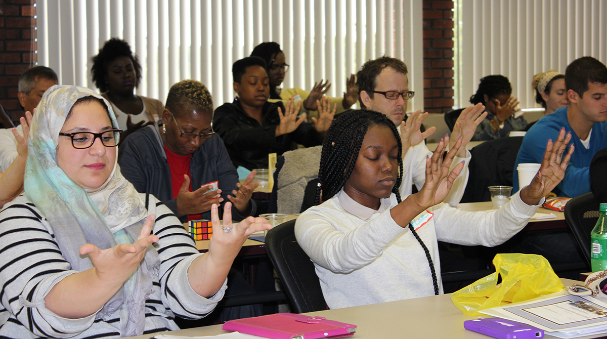 New AmeriCorps service members, trained during the summer at the Crim’s community school “boot camp,” are introduced to mindfulness techniques that help deepen self-awareness, reduce stress and increase well-being.