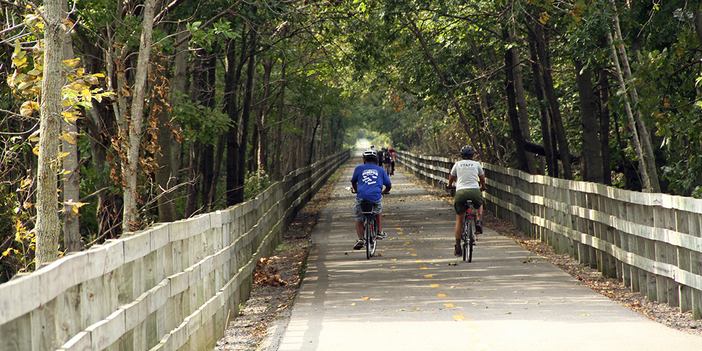 Bikers travel along the Oak Savannah Trail