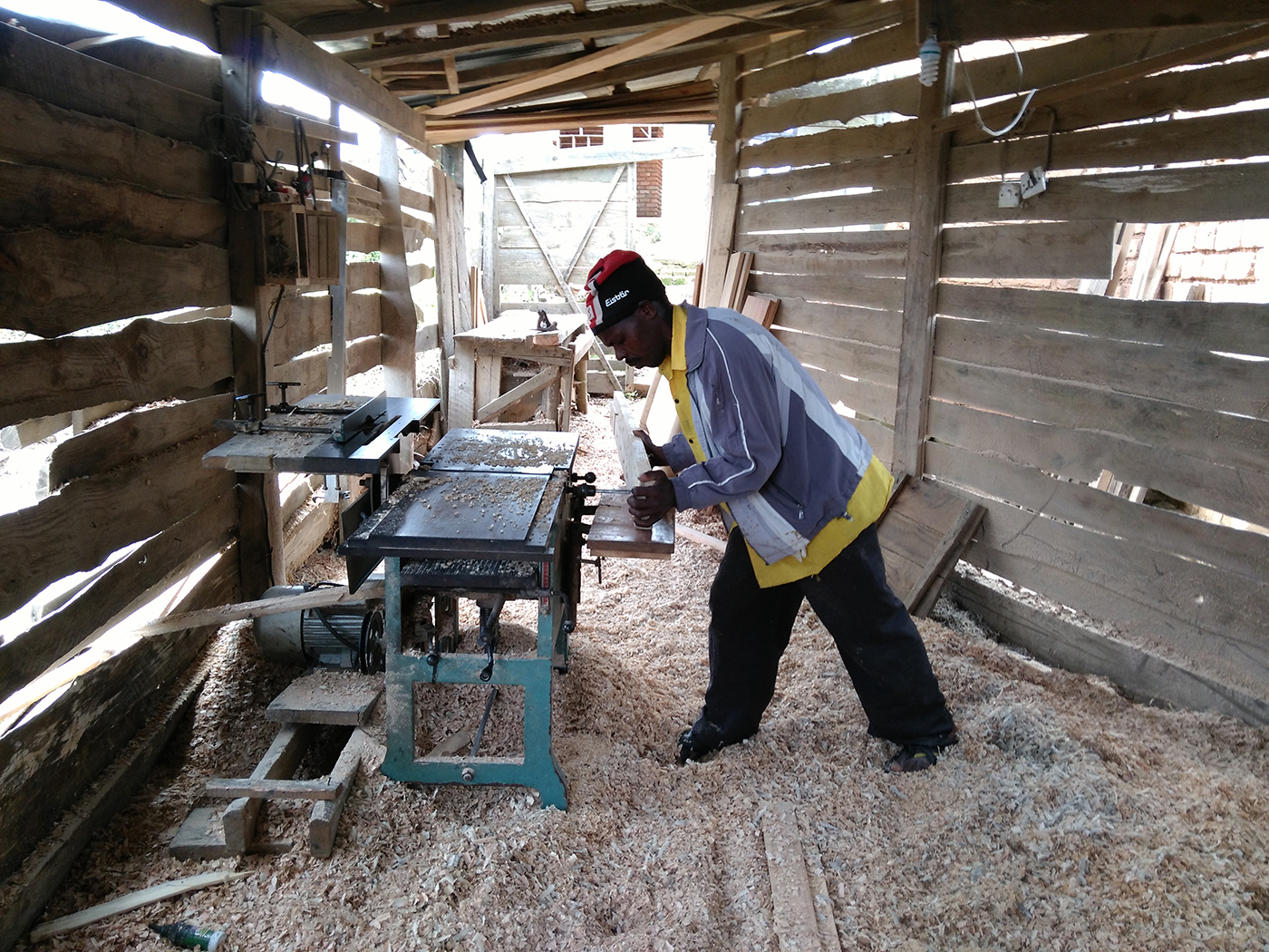 Tanzanian carpenter working in his workshop.