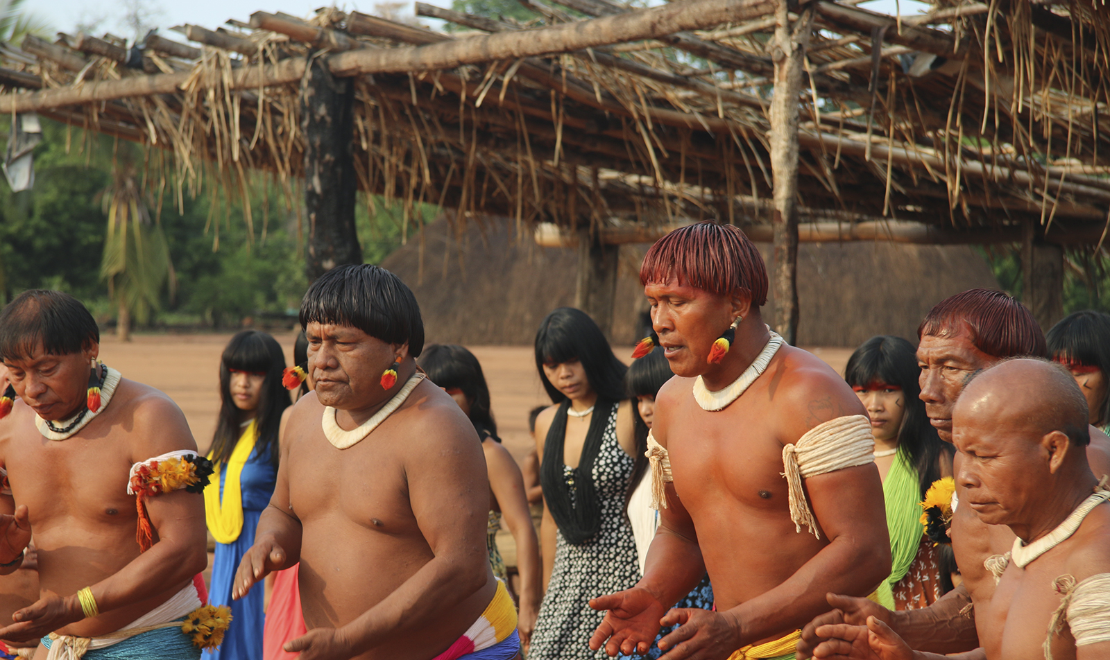 A group of indigenous people perform a traditional dance.