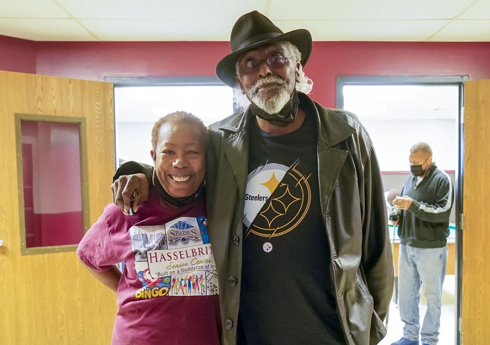 Beverly Lewis, executive director of the Hasselbring Senior Center, shares a smile with Justus Thigpen while standing together in the doorway of the Hasselbring Center's recreation room.