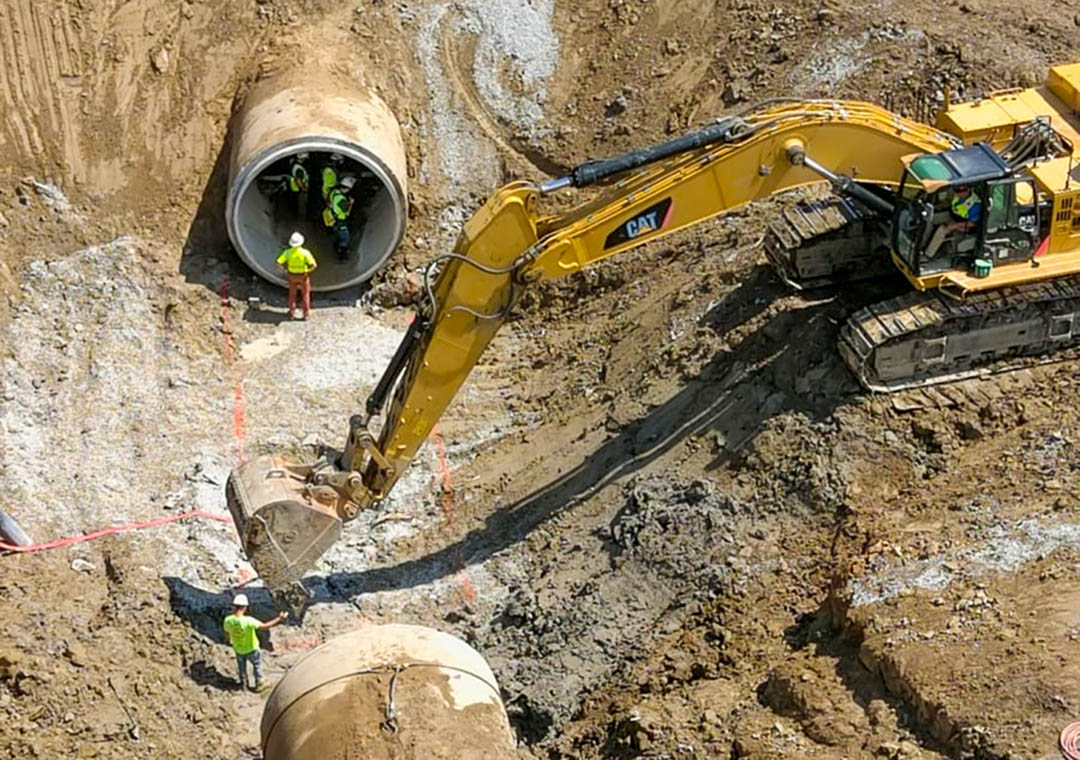 A photo of a deep pit in the earth shows the 2022 rupture of a massive pipeline that provided drinking water to southeast Michigan focused attention on the state’s aging water infrastructure.