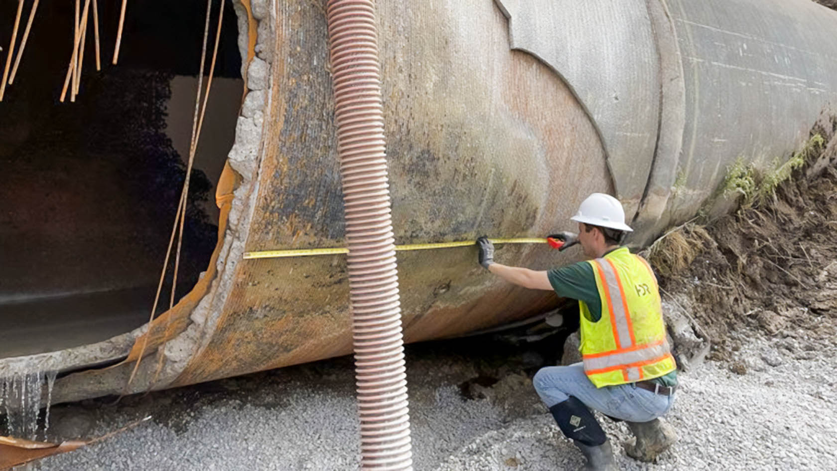 Great Lakes Water Authority worker inspects the water main that failed during the August 2022 water main rupture.