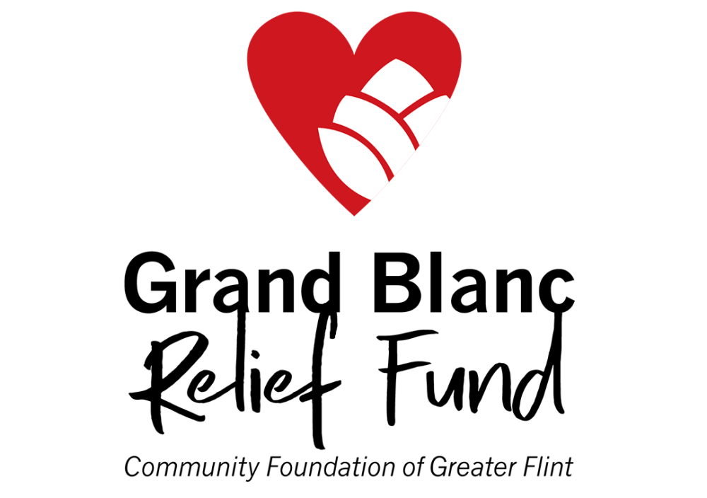 Grand Blanc Relief Fund logo that reads in all black "Grand Blanc Relief Fund Community Foundation of Greater Flint). There is a red heart with a white flower in it, symbolizing care. It appears right above the writing in the logo.