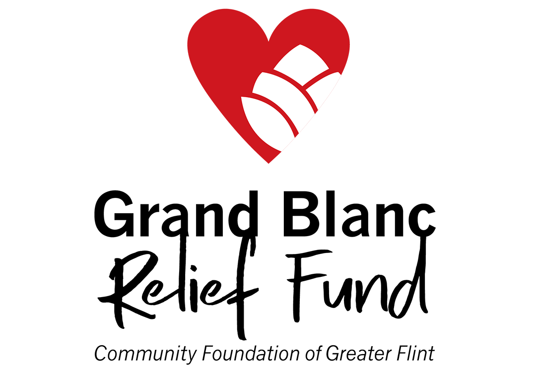 Grand Blanc Relief Fund logo that reads in all black "Grand Blanc Relief Fund Community Foundation of Greater Flint). There is a red heart with a white flower in it, symbolizing care. It appears right above the writing in the logo.