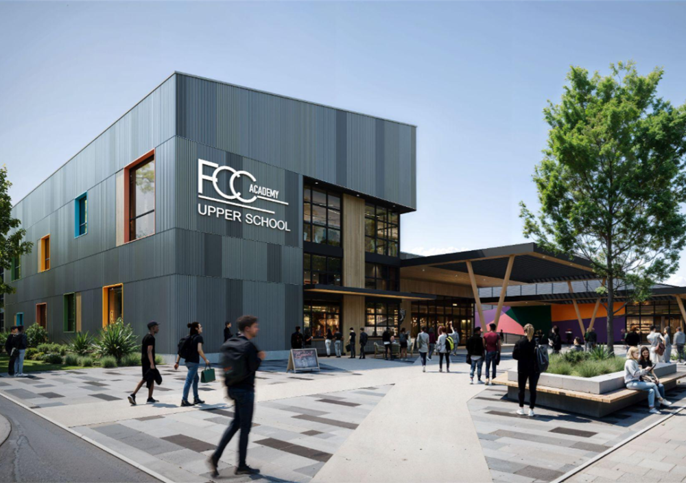 Exterior rendering of FCC Academy Upper School showing a modern two-story building with gray metal paneling and large windows, with the building signage reading “FCC Academy Upper School.” A covered entrance with angled wood supports extends from the right side, where multiple people walk and gather along paved walkways, landscaped planters, and outdoor seating areas with trees.