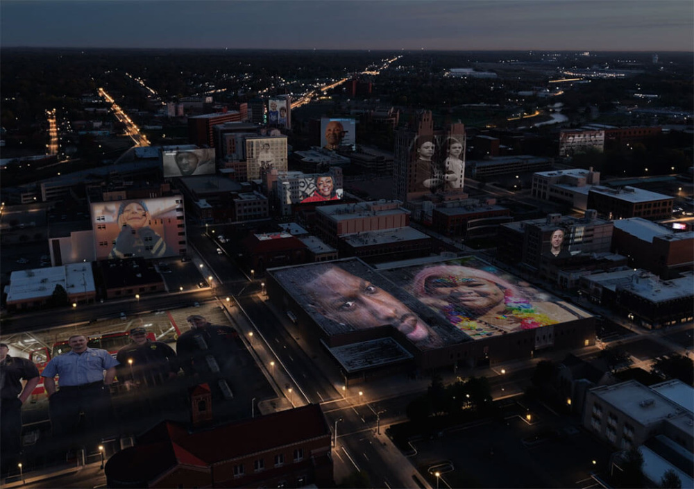 Drone footage of the city of Flint has portraits overlaid on the tops of some of the buildings.